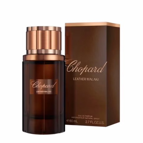 Детайл на бутилката Chopard Leather Malaki със златно лого и луксозна визия