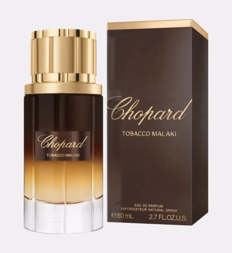Chopard Tobacco Malaki върху тъмен фон, подчертаващ топлия и опушен характер на аромата